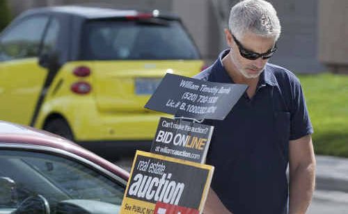 A prospective buyer looks over real estate listings before the start of a foreclosure auction in the US. Hopefully CQ will avoid many repossessions. A prospective buyer looks over real estate listings before the start of a foreclosure auction in the US. Hopefully CQ will avoid many repossessions.